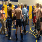 Lestock, the school's team trainer and a ref check out PHS wrestlers for skin infections. 