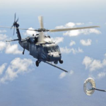 An U.S. Air Force HH-60G Pavehawk helicopter from the 55th Rescue Squadron flies above the Pacific Ocean in route to rescue two critically burned sailors 600 nautical miles of the coast of Mexico May 5, 2014. Airmen from the 563rd Rescue Group flew in a 79th RQS HC-130J Combat King II aircraft for nearly 11 hours, to parachute Guardian Angel teams near the ship, with two inflatable zodiac boat packages and medical equipment, so that they could deliver lifesaving care and stabilize the injured sailors. Guardian Angels are the only Department of Defense combat forces specifically organized, trained, equipped, and postured to conduct full spectrum personnel recovery operations. (U.S. Air Force photo by Staff Sgt. Adam Grant)